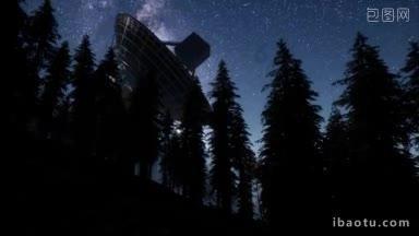 在星空下,天文<strong>发射</strong>器在森林中接收信号